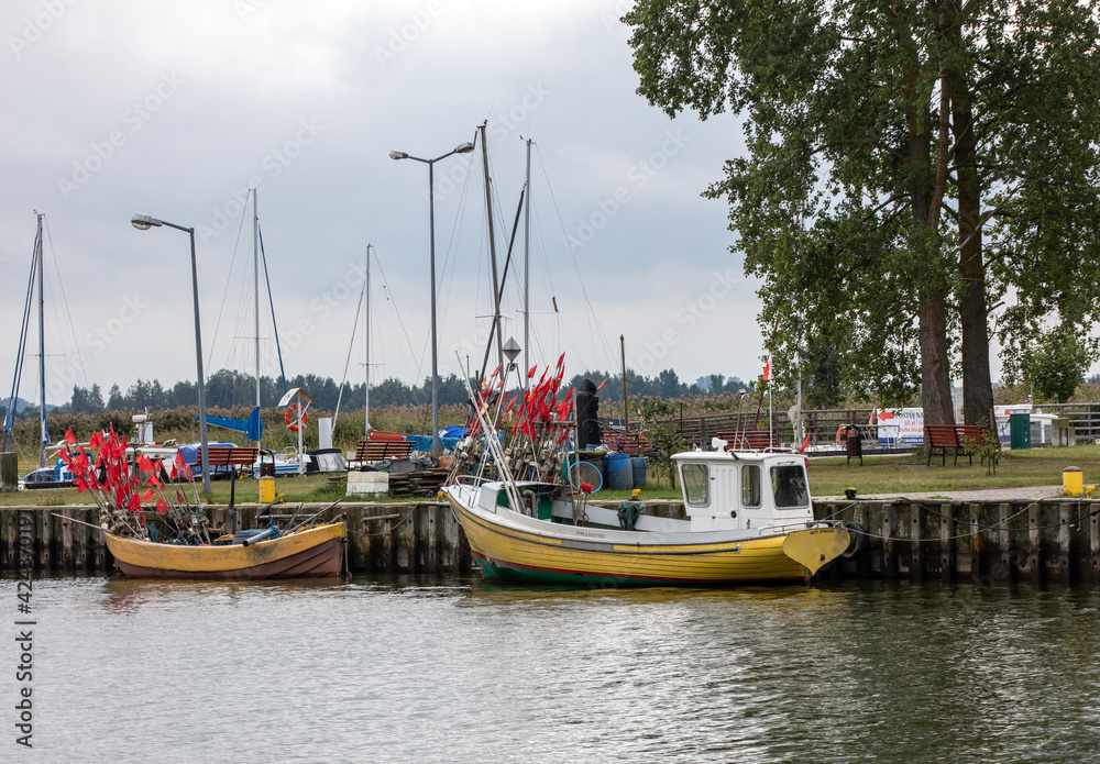  Fishing boats in port on the Vistula Lagoon in Katy Rybackie village located on the Vistula Spit between lagoon and Baltic Sea in Poland
