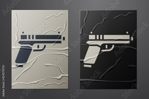 White Pistol or gun icon isolated on crumpled paper background. Police or military handgun. Small firearm. Paper art style. Vector