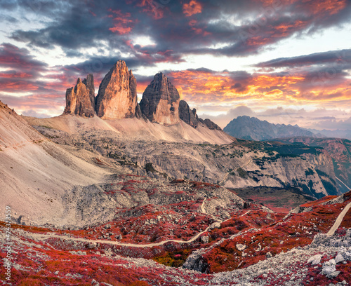 Wonderful evening view of Tre Cime Di Lavaredo mpountain peaks. Gorgeous autumn scene of Dolomite Alps, South Tyrol, Italy, Europe. Beauty of nature concept background. © Andrew Mayovskyy