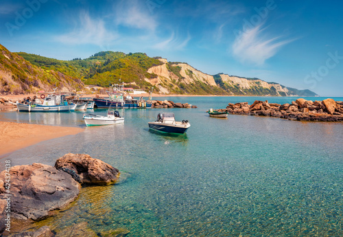 Fototapeta Naklejka Na Ścianę i Meble -  Beautiful marine scenery. Stunning morning view of small port in Gardenos village. Picturesque spring seascape of Ionian Sea. Attractive landscape of Corfu island, Greece, Europe.