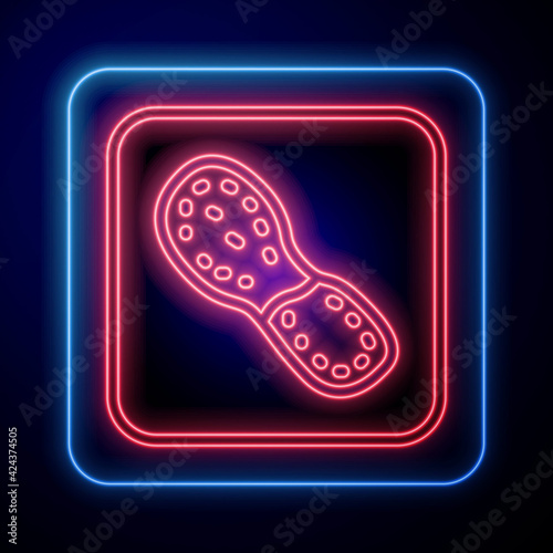 Glowing neon Human footprints shoes icon isolated on black background. Shoes sole. Vector