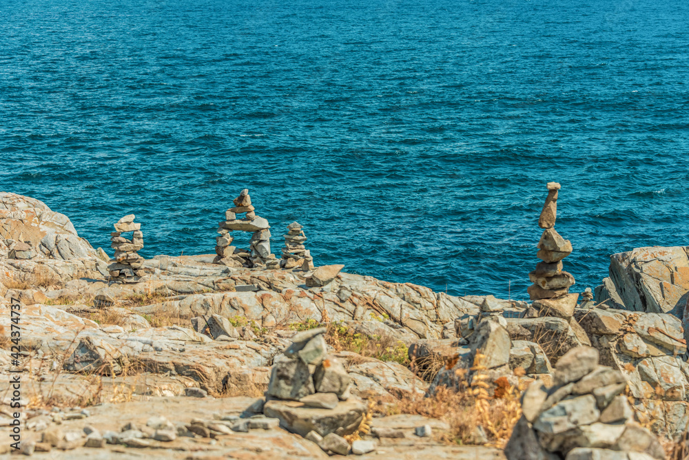 Handmade Stone figures by the sea 