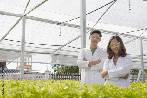 Hydroponics, two Asian scientists, tested the standards and collected chemical data of the organic vegetables grown using hydroponics in the nursery © Orathai