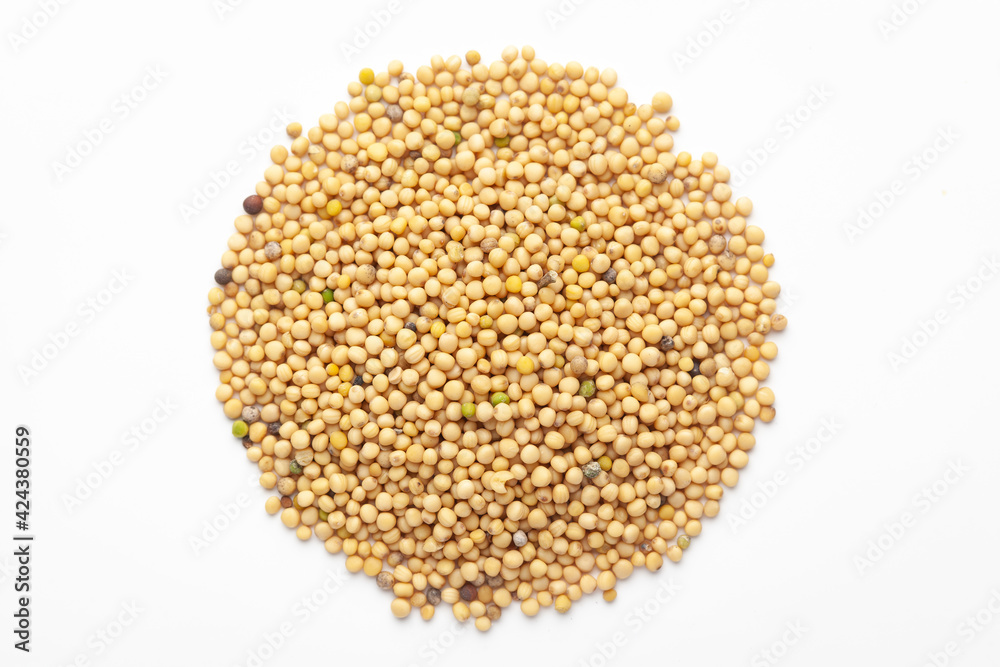 Macro close-up of Organic Mustard seed (Sinapis alba) on white background. Pile of Indian Aromatic Spice. Top view Macro close-up of Organic Mustard seed (Sinapis alba) on white background. Pile of Indian Aromatic Spice. Top view
