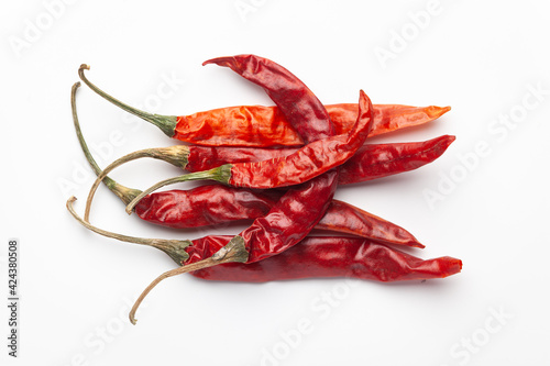 Macro close-up of Organic red chili pepper( Capsicum annuum) on white background. Pile of Indian Aromatic Spice. Top view