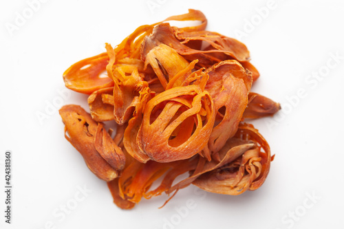 Macro close-up of Organic mace  (Myristica fragrans) on white background. Pile of Indian Aromatic Spice. Top view photo