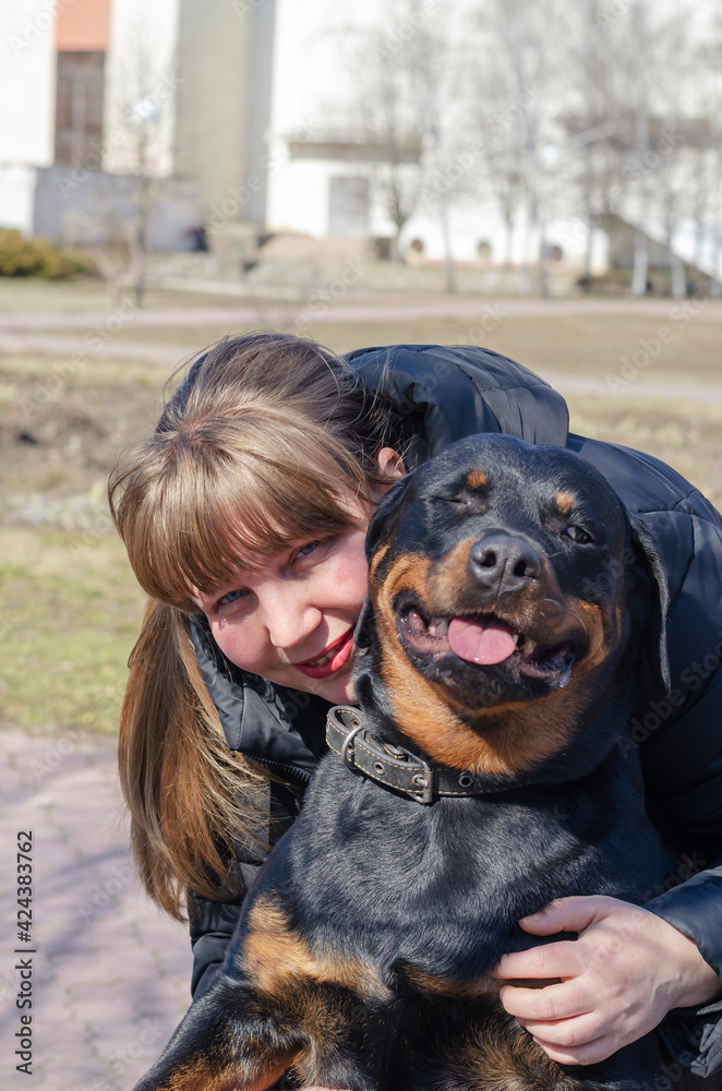 Portrait of a happy woman hugging her pet. Portrait of a happy woman hugging her pet.