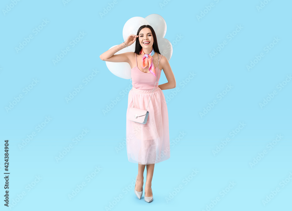 Beautiful young woman with balloons on color background Beautiful young woman with balloons on color background