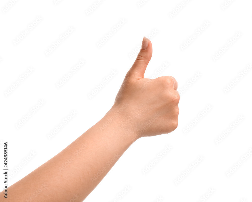 Female hand showing thumb-up gesture on white background Female hand showing thumb-up gesture on white background