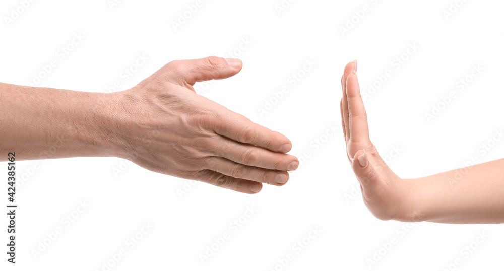 Woman refusing to shake hand of man on white background Woman refusing to shake hand of man on white background