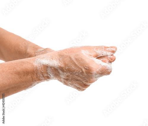 Man washing hands on white background