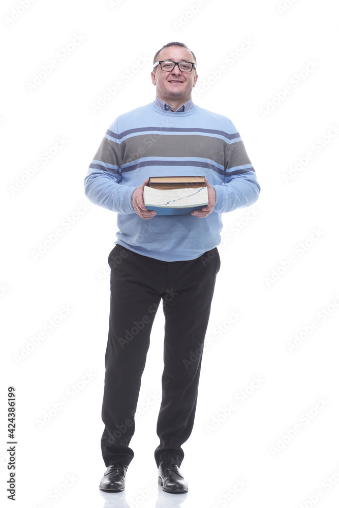 in full growth. confident mature man with a stack of books. in full growth. confident mature man with a stack of books.