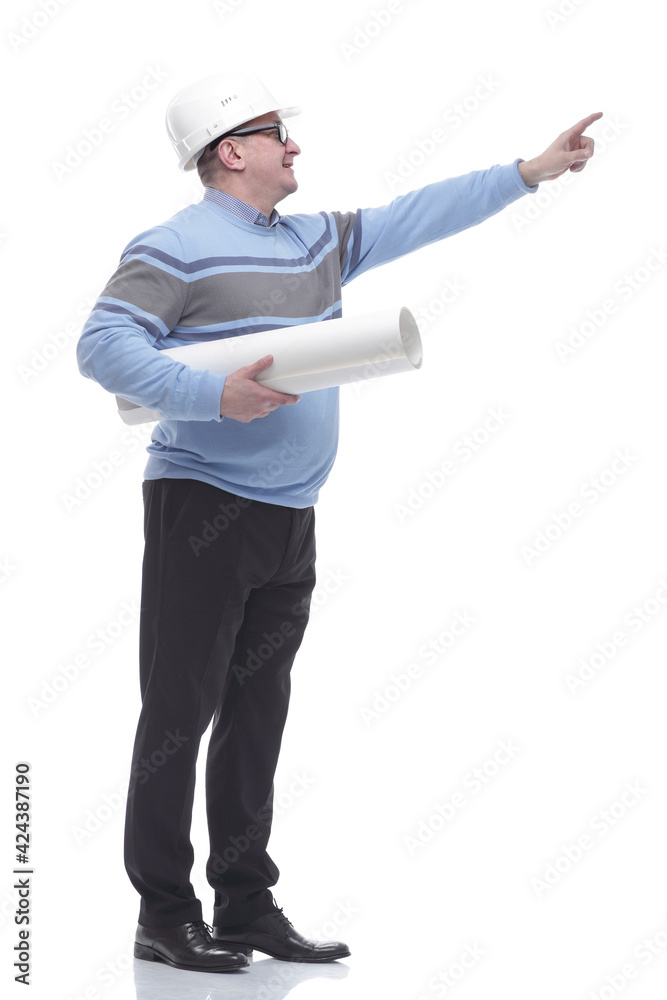side view. a man with a roll of drawings looking somewhere ahead. side view. a man with a roll of drawings looking somewhere ahead.