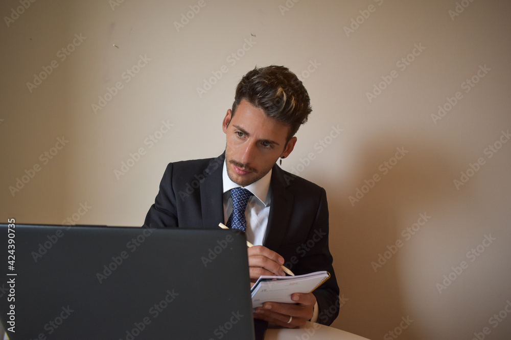 businessman in suit working at computer. businessman in suit working at computer.