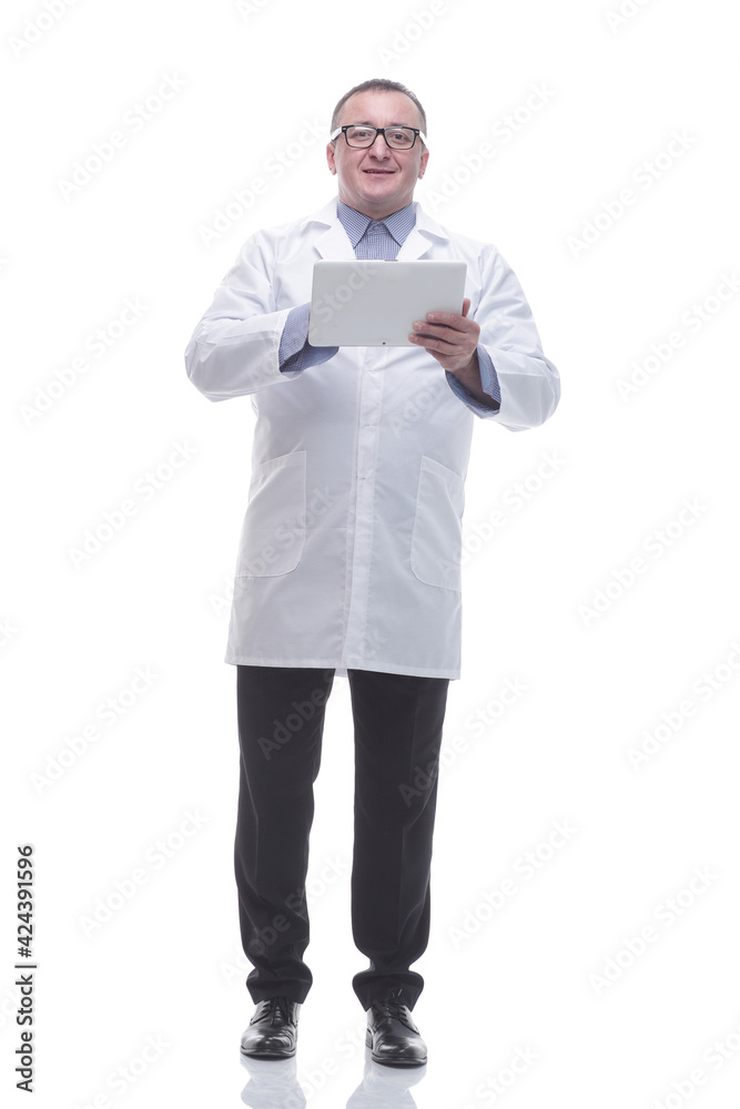 in full growth. a competent doctor using a digital tablet in full growth. a competent doctor using a digital tablet
