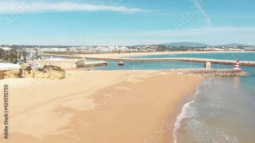 Fort of Ponta da Bandeira next to Bensafrim River's estuary, Lagos, Algarve Portugal - Aerial slide wide shot photo