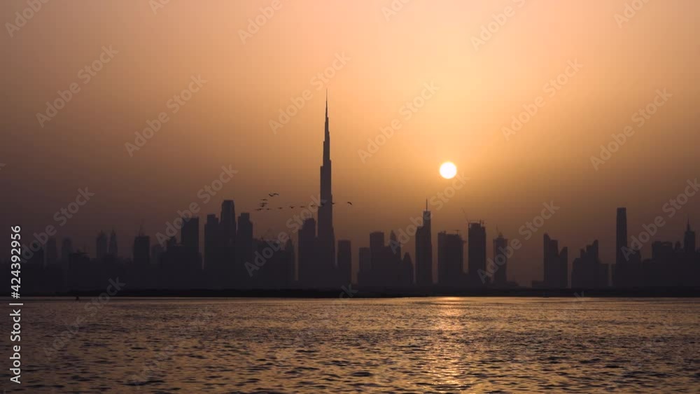 Scenic View Of Dubai Skyline And Bay In The Early Evening - wide shot Scenic View Of Dubai Skyline And Bay In The Early Evening - wide shot