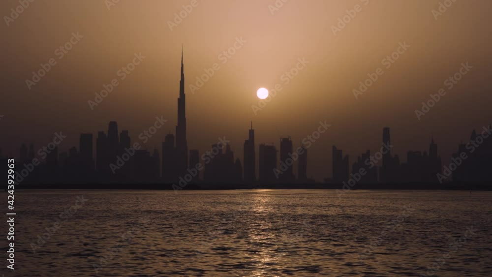 Calm Evening View Of Dubai Business District By The Bay In United Arab Emirates - wide shot Calm Evening View Of Dubai Business District By The Bay In United Arab Emirates - wide shot