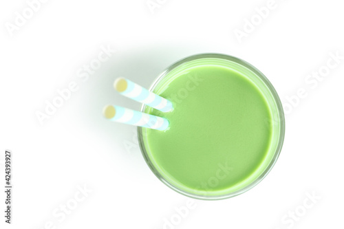 Glass of green smoothie isolated on white background