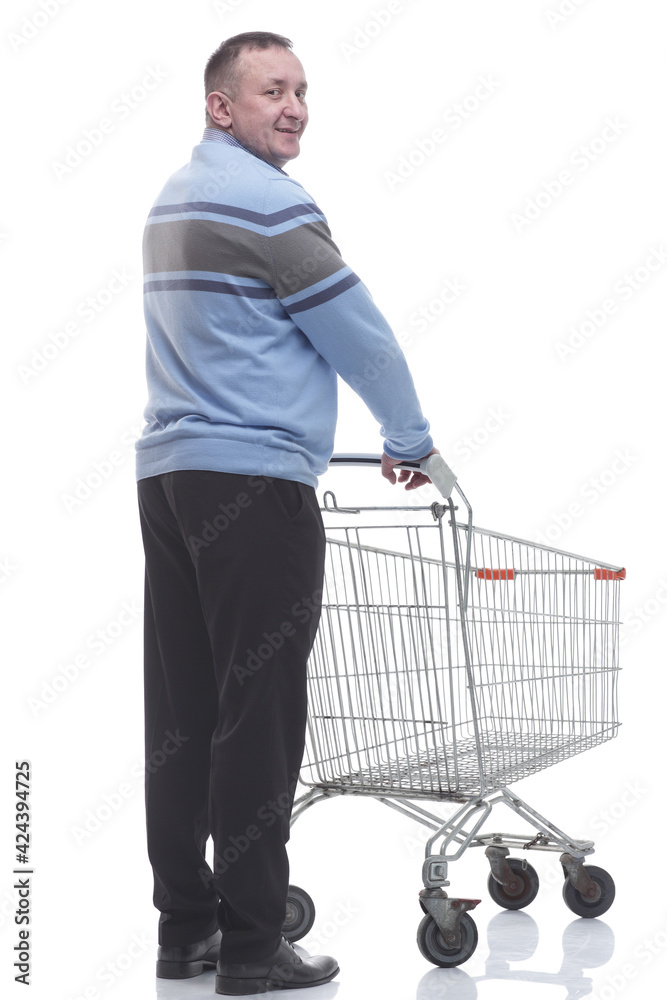 rear view. casual man with a cart standing in front of a white screen rear view. casual man with a cart standing in front of a white screen