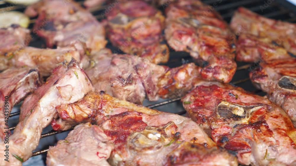 Roasted delicious meat on the grill in slow motion 180fps