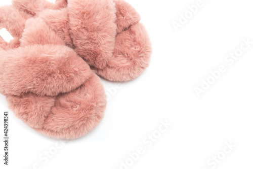 pink fluffy home women slippers supply isolated onn white background .