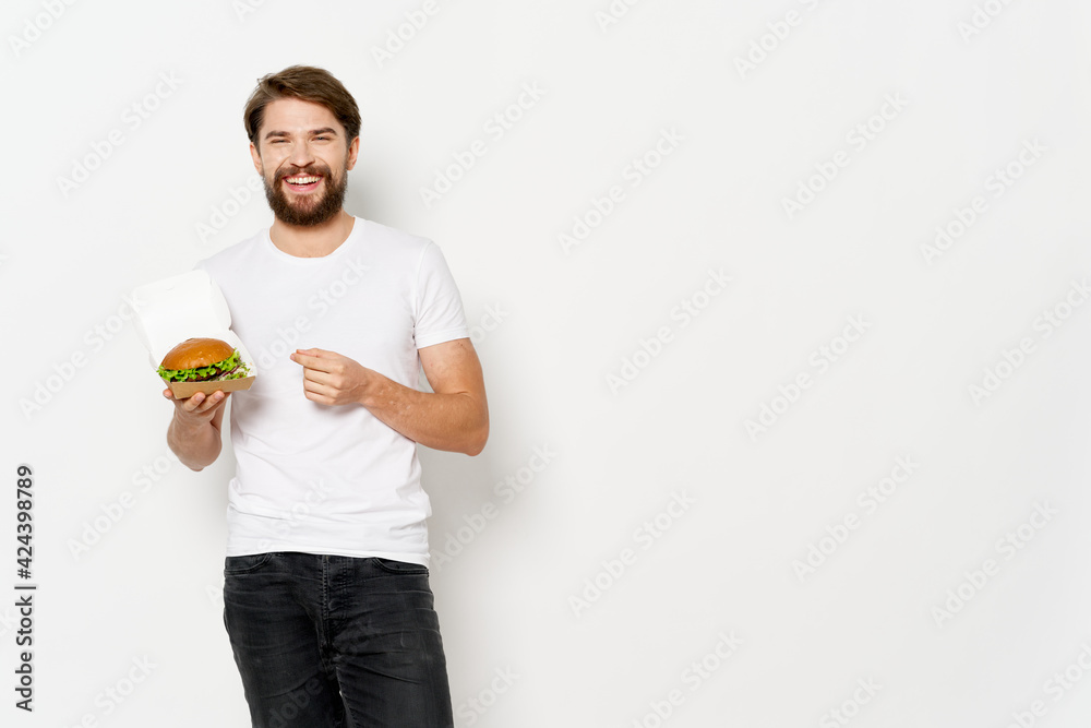 man in white t-shirt hamburger fast food diet snack man in white t-shirt hamburger fast food diet snack