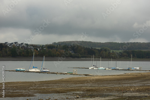 View from the german lake called Moehnesee with tiny boats photo