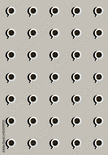 A pattern with mugs filled with black coffee on a gray background. Top view