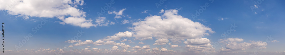 Wide sky panorama with scattered cumulus clouds Wide sky panorama with scattered cumulus clouds