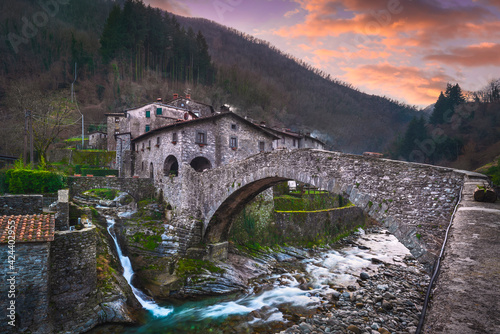 Fabbriche di Vallico ancient village and old bridge over the creek. Apuane park. Garfagnana, Tuscany, Italy.