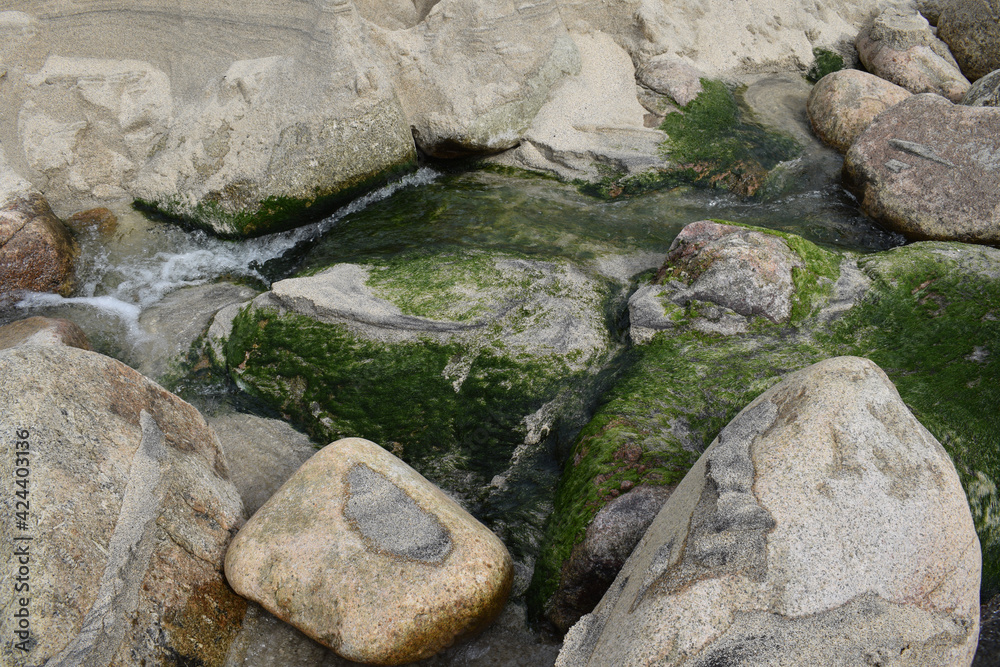 A stream on Portheras Beach Cornwall A stream on Portheras Beach Cornwall