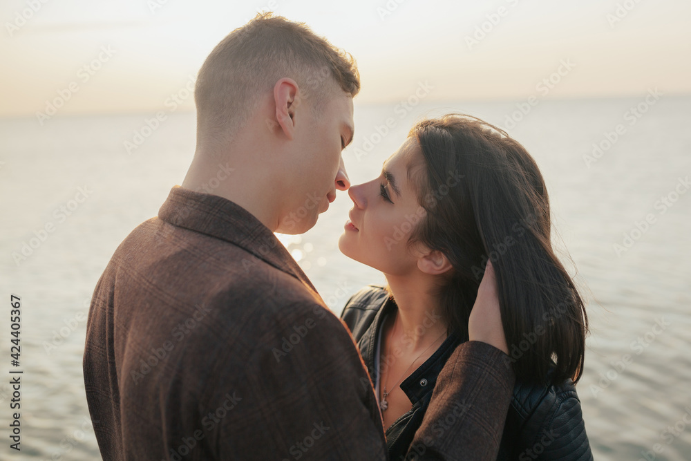 Close up of passionate couple want to kiss on the coast of sea. Close up of passionate couple want to kiss on the coast of sea.