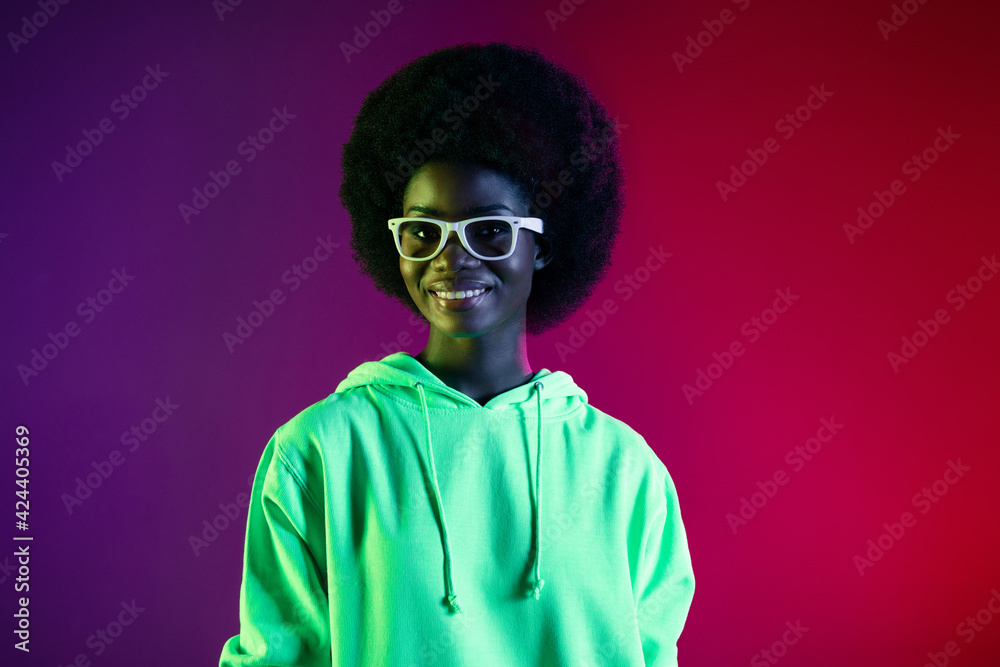 Photo of cheerful retro 80s lady look camera toothy smile wear glasses hoodie isolated gradient neon background