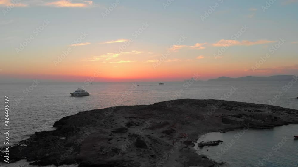 Drone view of a man walking at an island in the middle of the sea in the belearic island of Formentera Drone view of a man walking at an island in the middle of the sea in the belearic island of Formentera