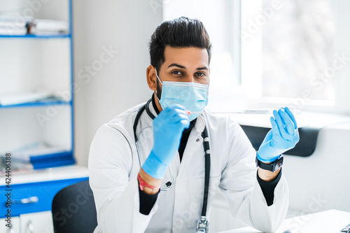 Doctor in a protective mask and gloves with a test for code 19  health and medicine