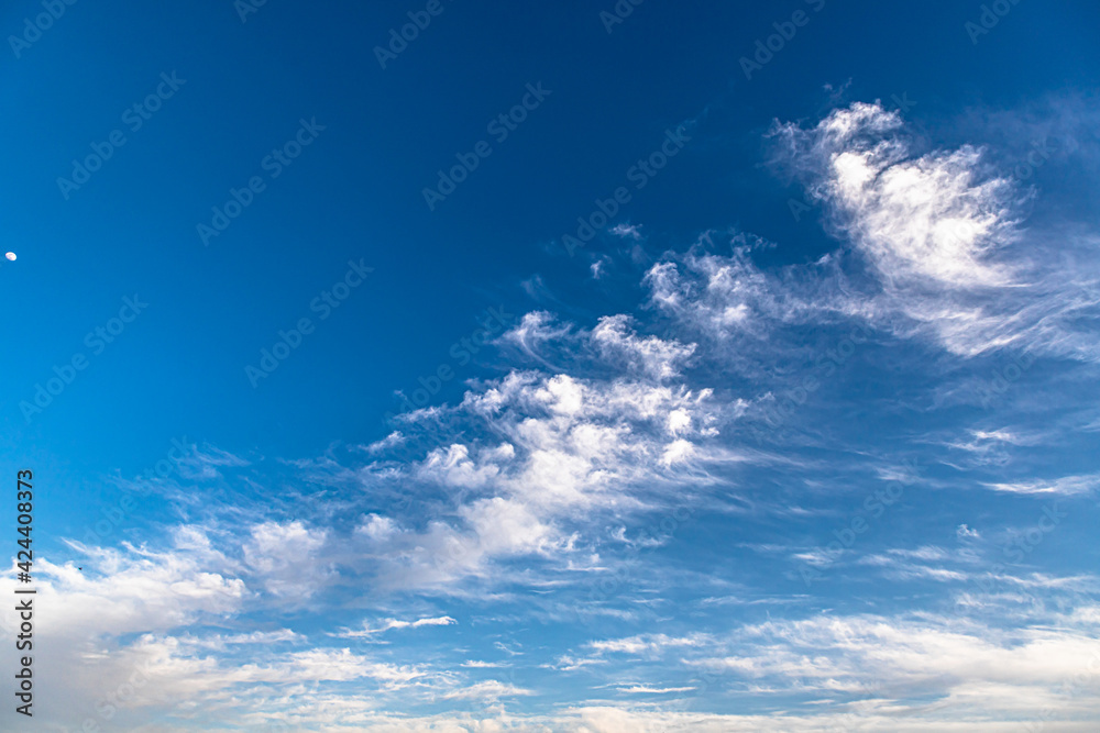 beautiful blue background with clouds and moon and clouds pattern.