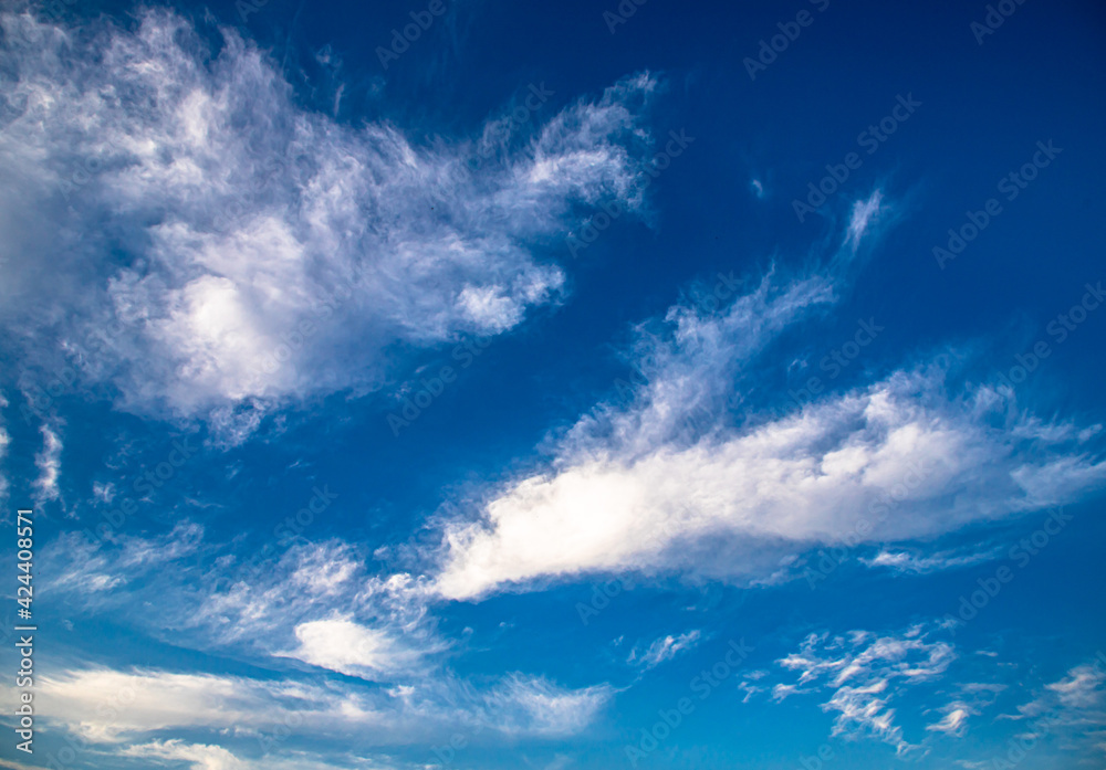 Obraz premium beautiful blue background with clouds and moon and clouds pattern.