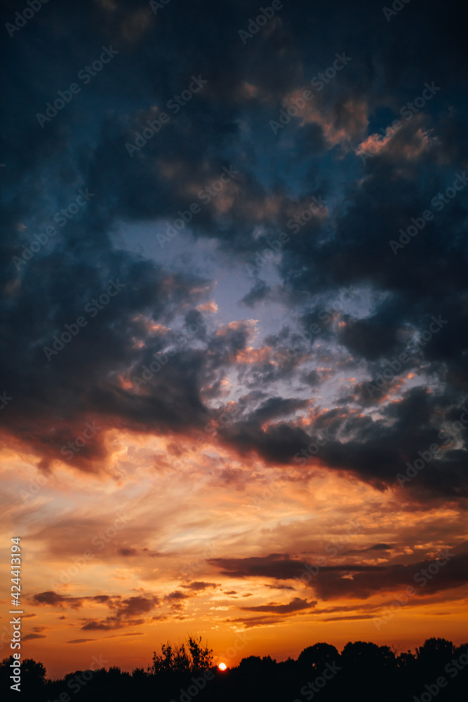 Fototapeta premium beautiful bright sunset, expressive blue-orange sky. Evening time