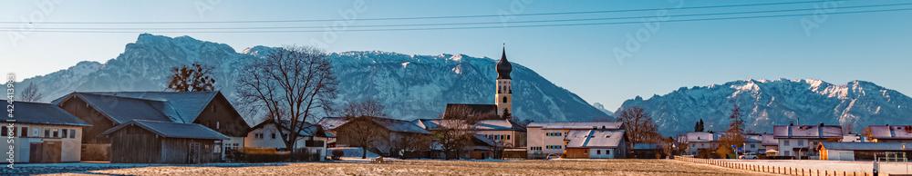 Beautiful winter landscape with a church and the famous Untersberg summit in the background on a sunny morning at Feldkirchen near Bad Reichenhall, Bavaria, Germany Beautiful winter landscape with a church and the famous Untersberg summit in the background on a sunny morning at Feldkirchen near Bad Reichenhall, Bavaria, Germany