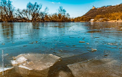 Beautiful winter landscape with details of ice sheets in the water at the famous Bogenberg, Danube, Bavaria, Germany