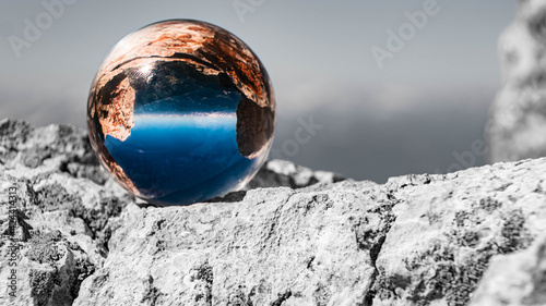 Crystal ball alpine landscape shot with black and white background outside the sphere at the famous Dachstein summit, Schladming, Steiermark, Austria © Martin Erdniss
