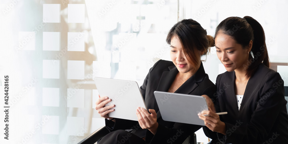 Group of young people working together with digital tablet. Creative business people in modern office. Group of young people working together with digital tablet. Creative business people in modern office.