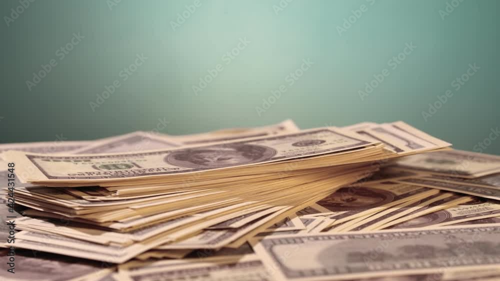 Dollar bills on a table. Rotation paper money close-up. Dollar bills on a table. Rotation paper money close-up.