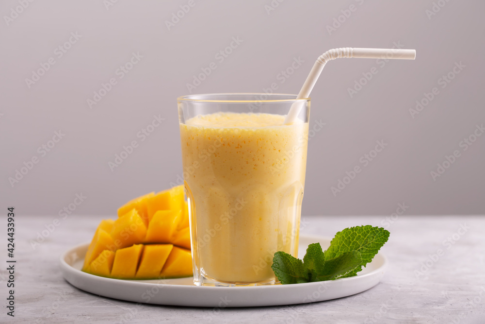 Lassi is a popular traditional yogurt based cold drink with mango Lassi is a popular traditional yogurt based cold drink with mango