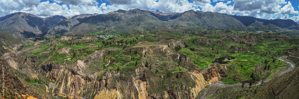 Panoramic aerial view of agricultural terraced fields in Colca Canyon in Peru. Southamerican valley, landscape and mountains. Colca river
