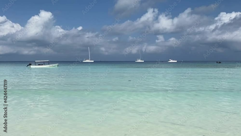 Movement towards the azure water of the ocean against the backdrop of a beautiful blue sky. Vacation and travel concept. Movement towards the azure water of the ocean against the backdrop of a beautiful blue sky. Vacation and travel concept.