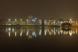 Reflection of city lights in the river. Evening illumination of Kiev.