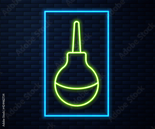 Glowing neon line Enema icon isolated on brick wall background. Enema with a plastic tip. Medical pear. Vector