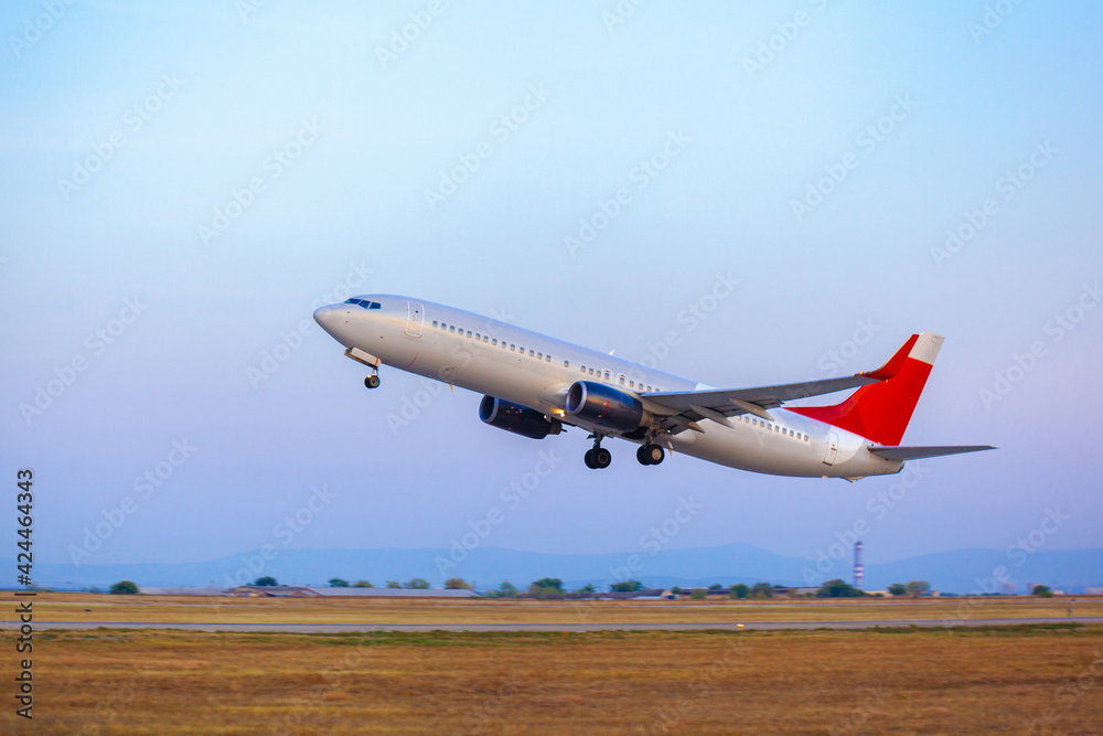 Passenger plane takes off from runway in airport Passenger plane takes off from runway in airport